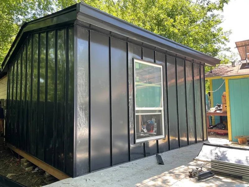 Black standing seam metal wall panels for Metal Roof Installation in Iowa Colony