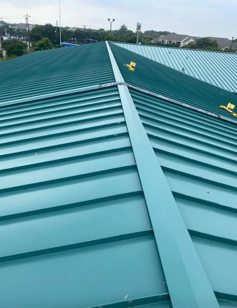 Green commercial metal roof ridge and valley for Metal Roof Repair in Iowa Colony